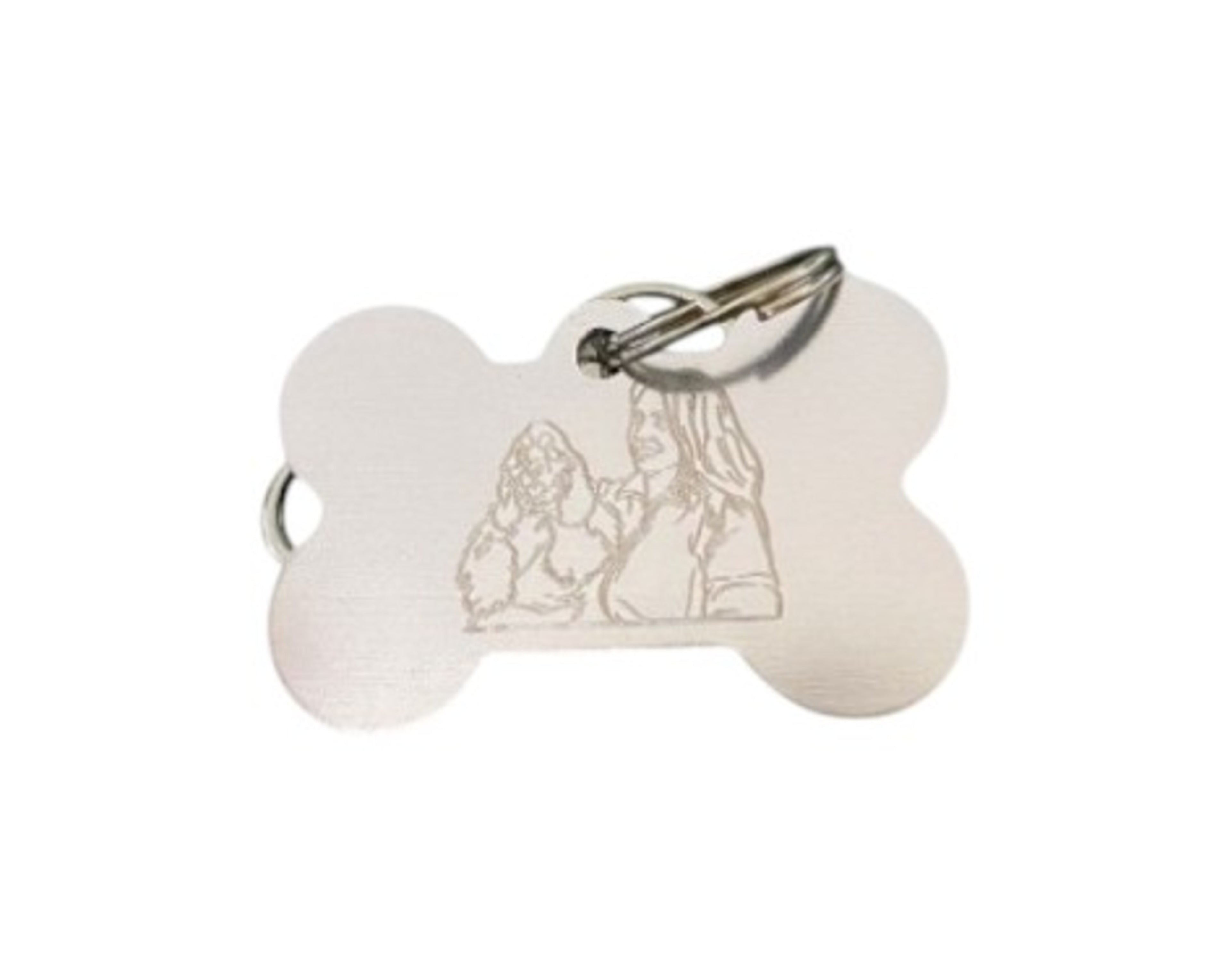 Breloc metalic în formă de os